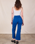 Back view of Western Pants in Royal Blue and Cropped Cami in Vintage Tee Off-White on Alex