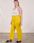 Side view of Western Pants in Golden Yellow and Cropped Tank in Vintage Tee Off-White on Lish