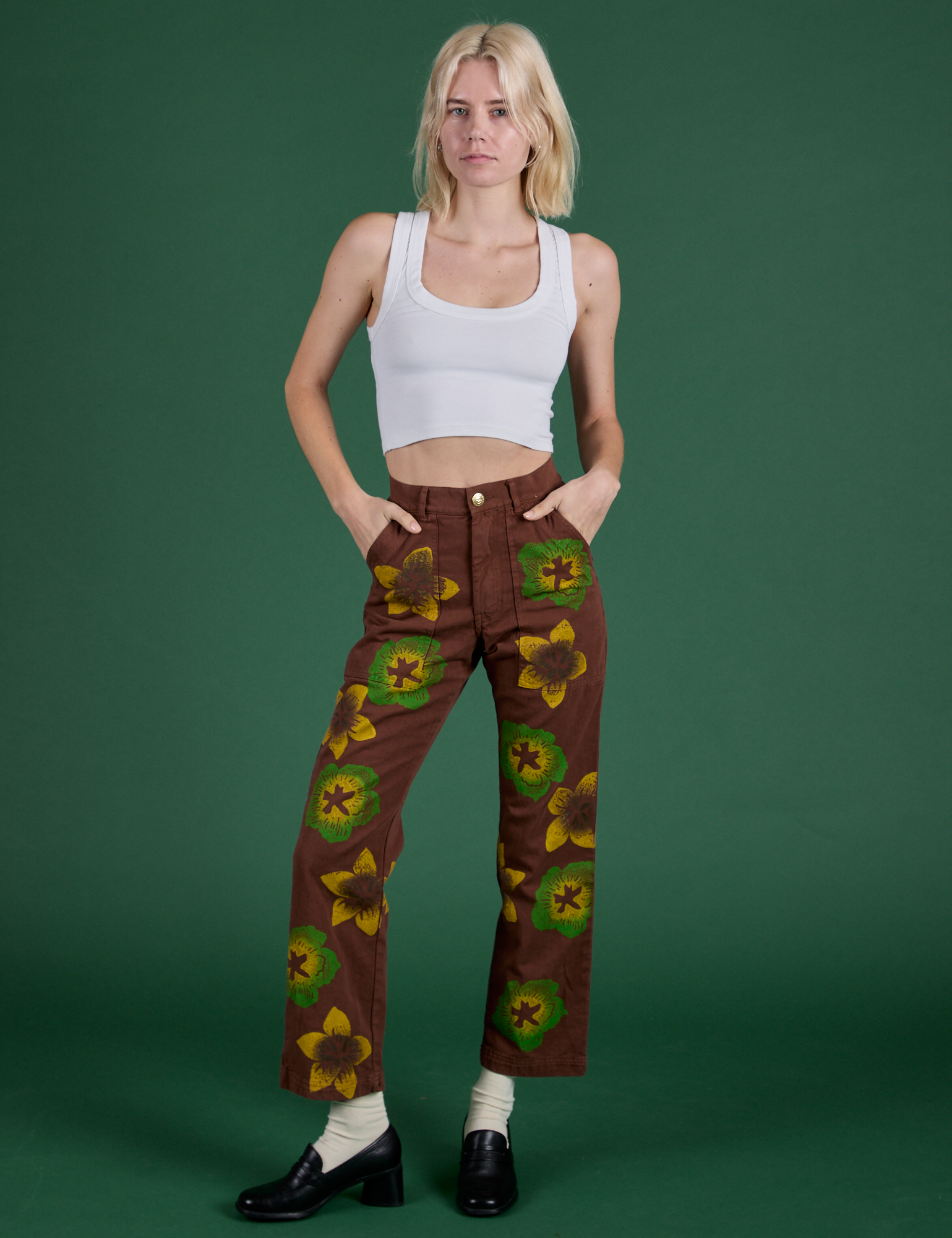 Madeline is 5’9” and wearing XXS Floral Painted Work Pants in Brown in Cropped Tank in Vintage Tee White