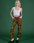 Madeline is 5’9” and wearing XXS Floral Painted Work Pants in Brown in Cropped Tank in Vintage Tee White