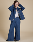 Hana is wearing Indigo Denim Work Jacket in Dark Wash and dark wash Indigo Wide Leg Trousers