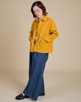 Denim Work Jacket in Mustard Yellow and dark wash Indigo Wide Leg Trousers on Hana