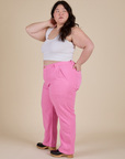 Side view of  Work Pants in Bubblegum Pink and Cropped Tank in Vintage Tee White on Ashley