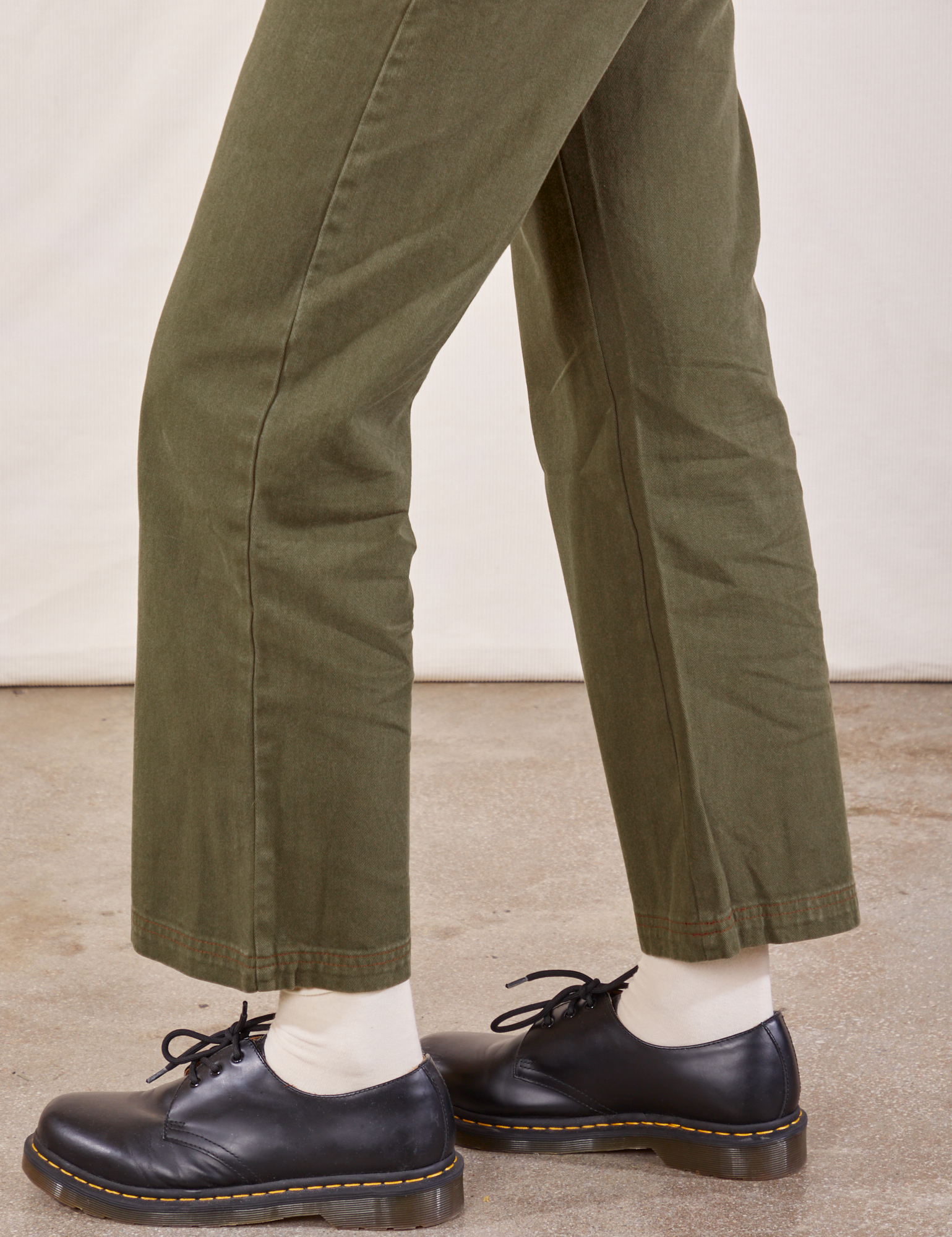 Work Pants in Surplus Green side view pant leg close up on Margaret