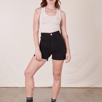 Alex is 5'8" and wearing size XS Classic Work Shorts in Basic Black paired with vintage off-white Tank Top