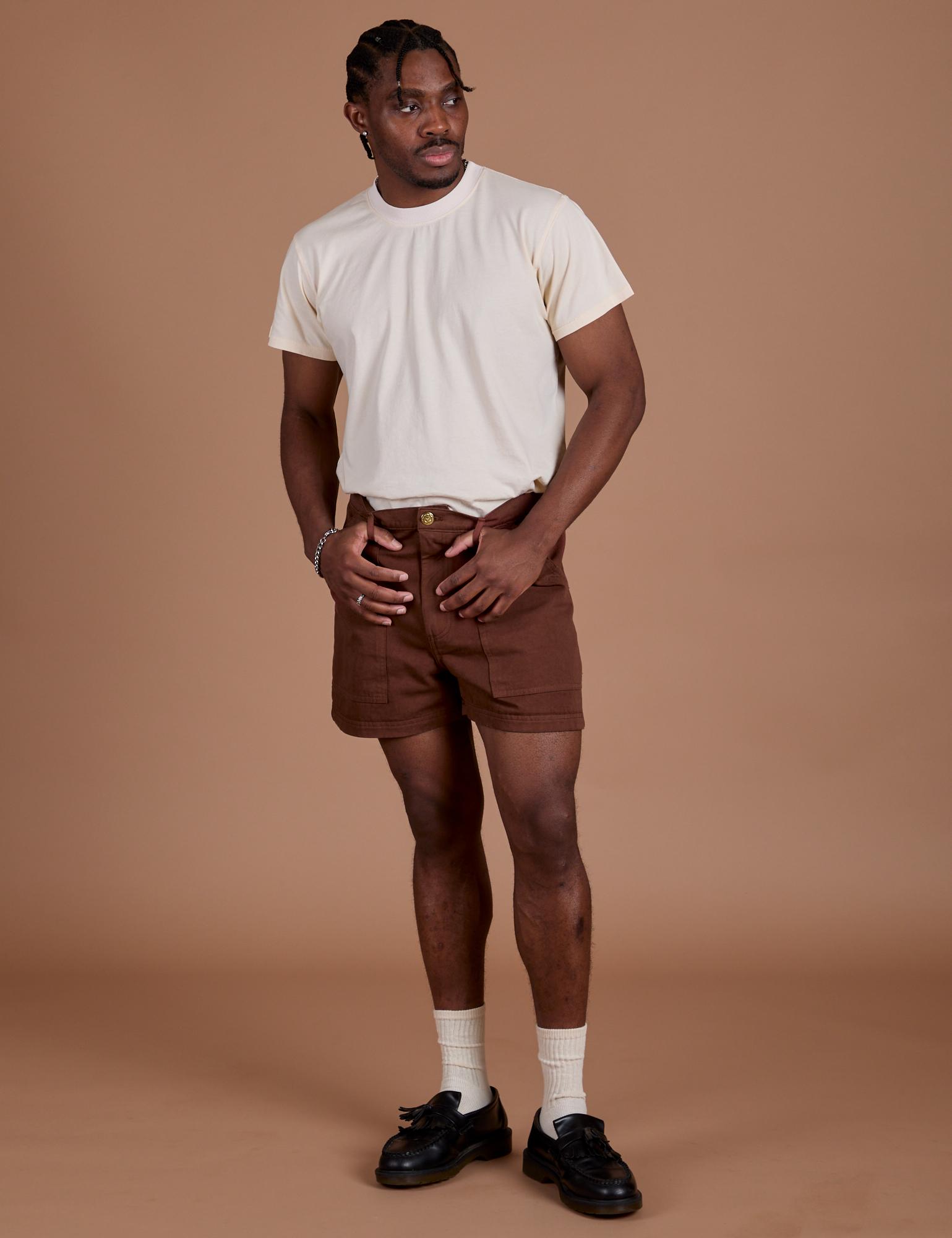 Isaac is wearing Classic Work Shorts in Fudgesicle Brown and Organic Vintage Tee in Vintage Off-White