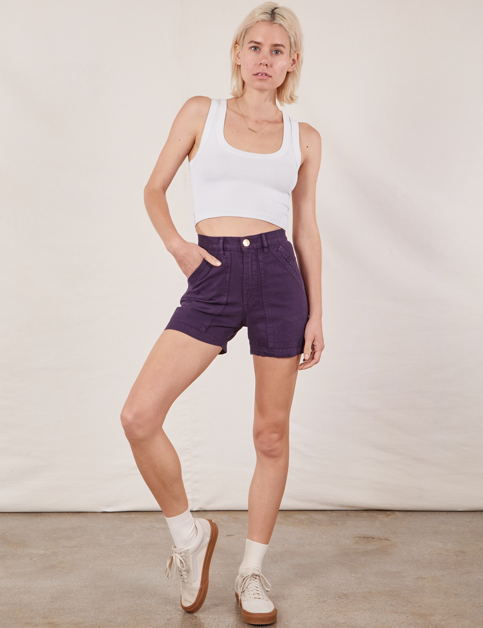 Madeline is 5’9” and wearing XXS Classic Work Shorts in Nebula Purple paired with Cropped Tank Top in vintage tee off-white