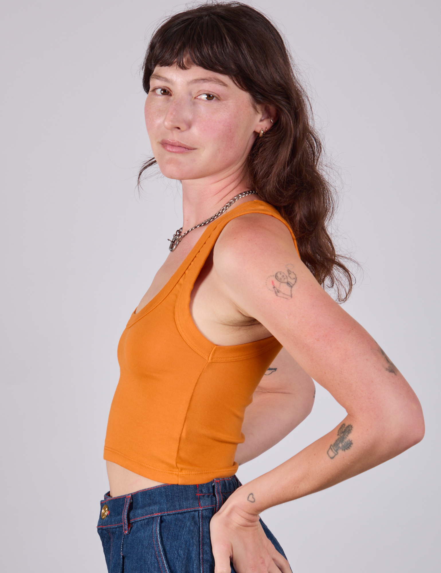 Cropped Tank Top in Creamsicle Orange side view on Alex