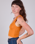 Cropped Tank Top in Creamsicle Orange side view on Alex