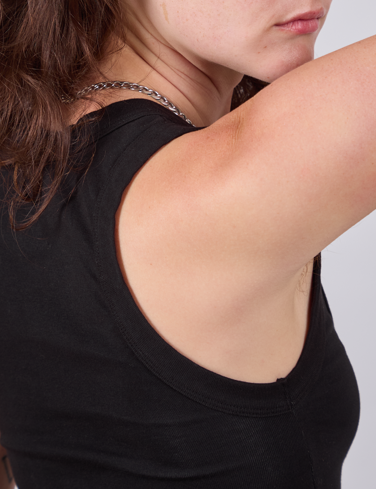 Cropped Tank Top in Basic Black shoulder close up on Alex