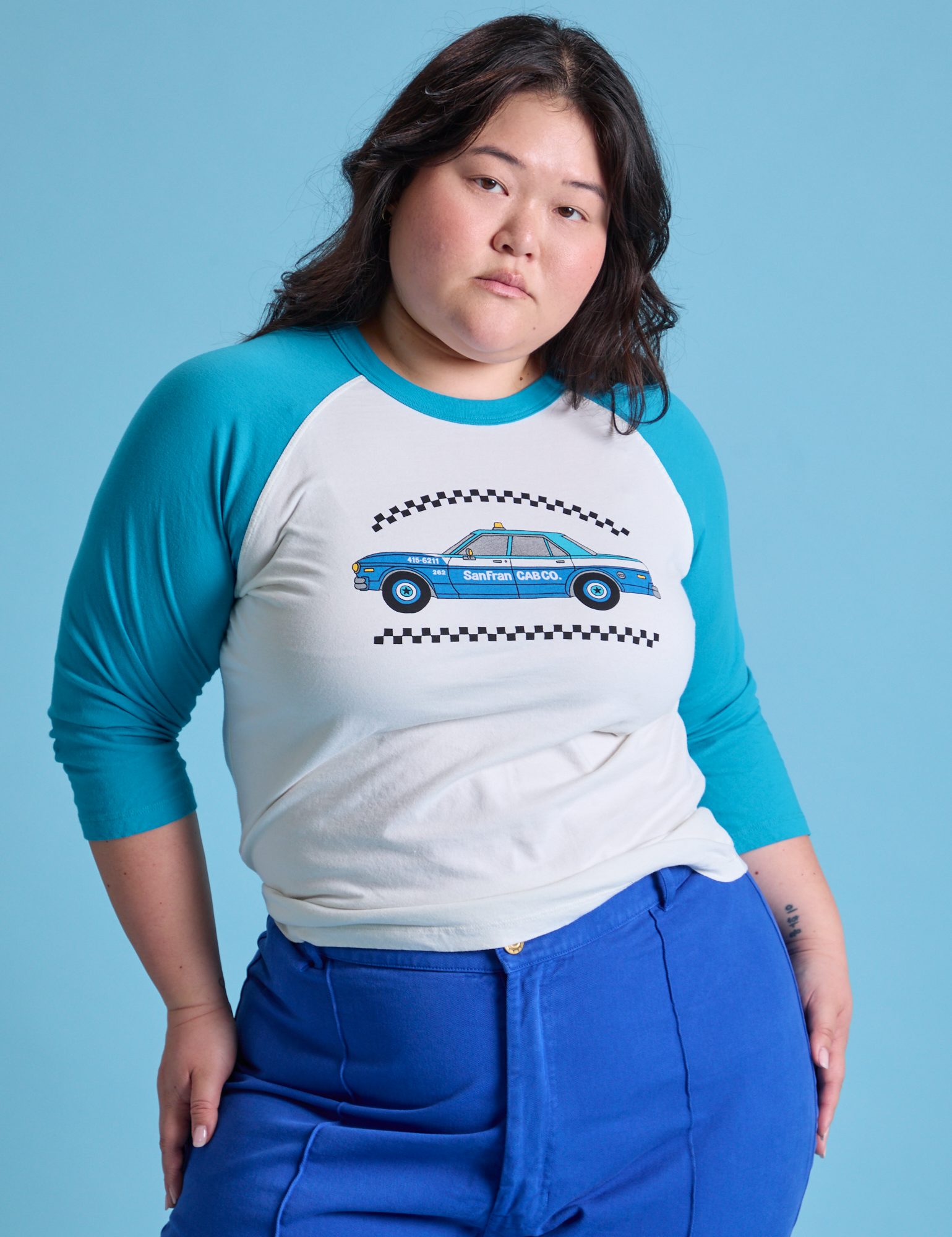 Ashley is 5&#39;7&quot; and wearing L Taxi Raglan Tee in San Francisco