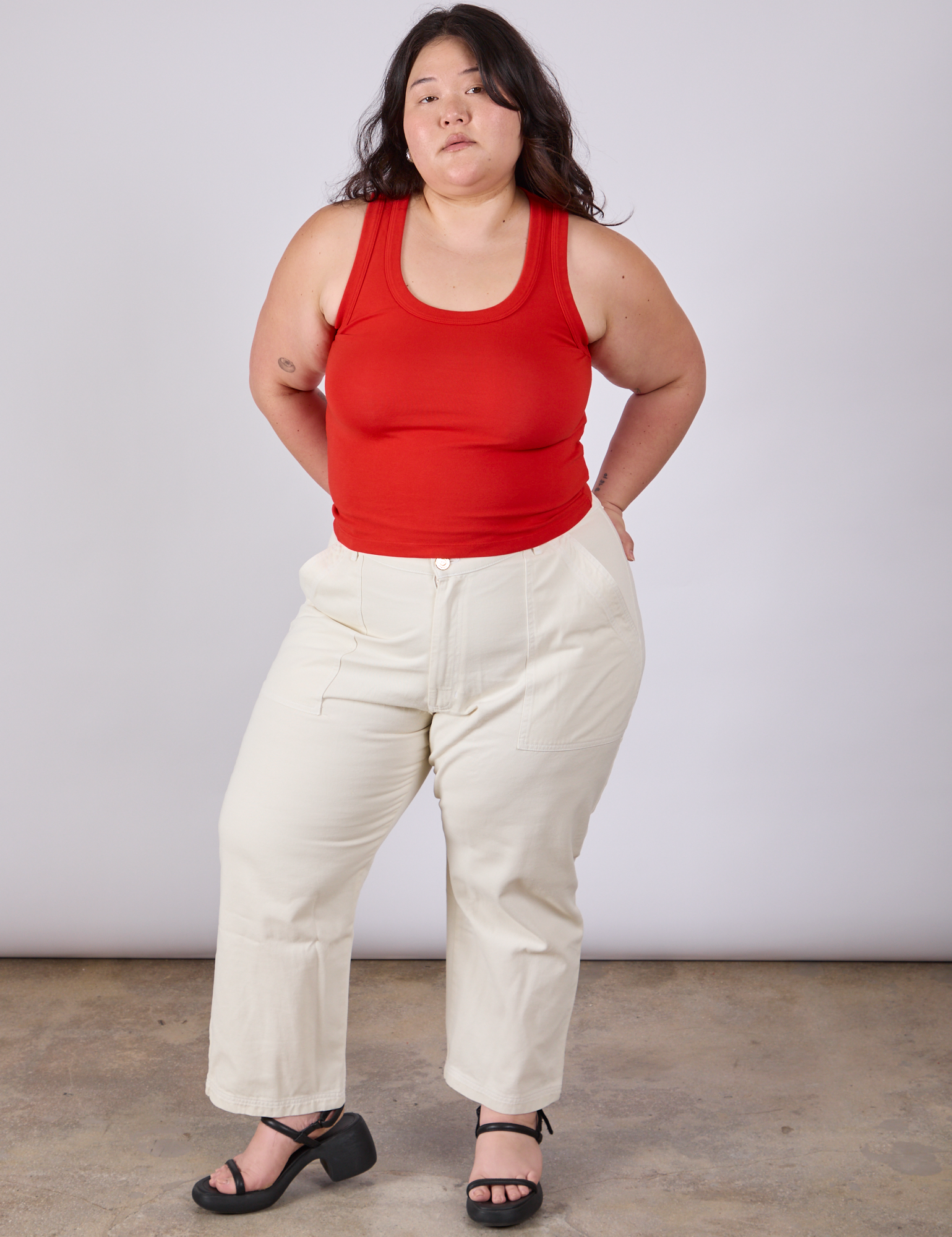 Ashley is wearing Tank Top in Mustang Red and vintage tee off-white petite Work Pants