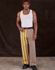 Isaac is 5'10" and wearing M Mixed Stripe Work Pants paired with a Tank Top in vintage tee off-white