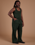 Angled front view of Action Pants in Swamp Green and swamp green Tank Top on Demi