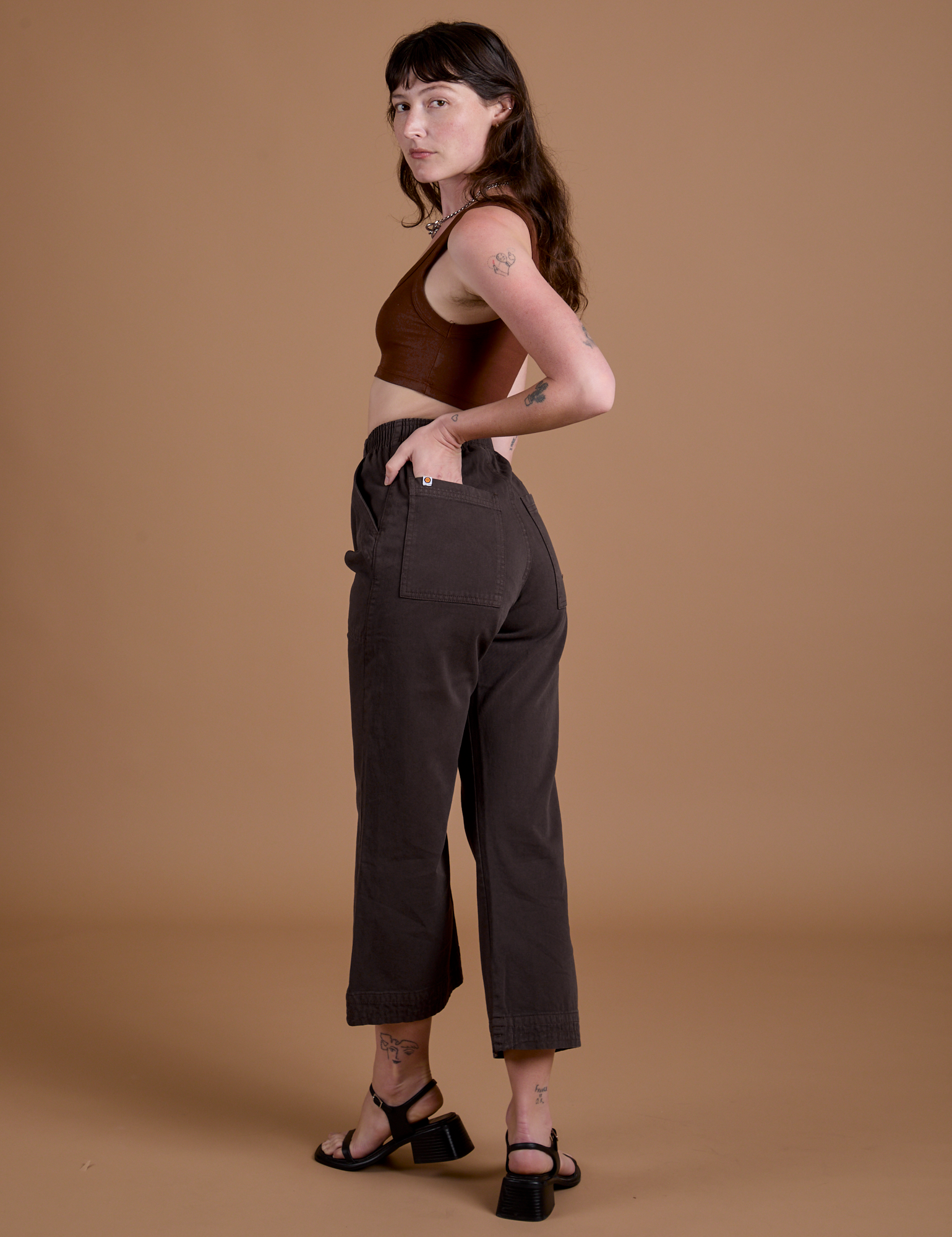 Angled back view of Work Pants in Espresso Brown on Alex