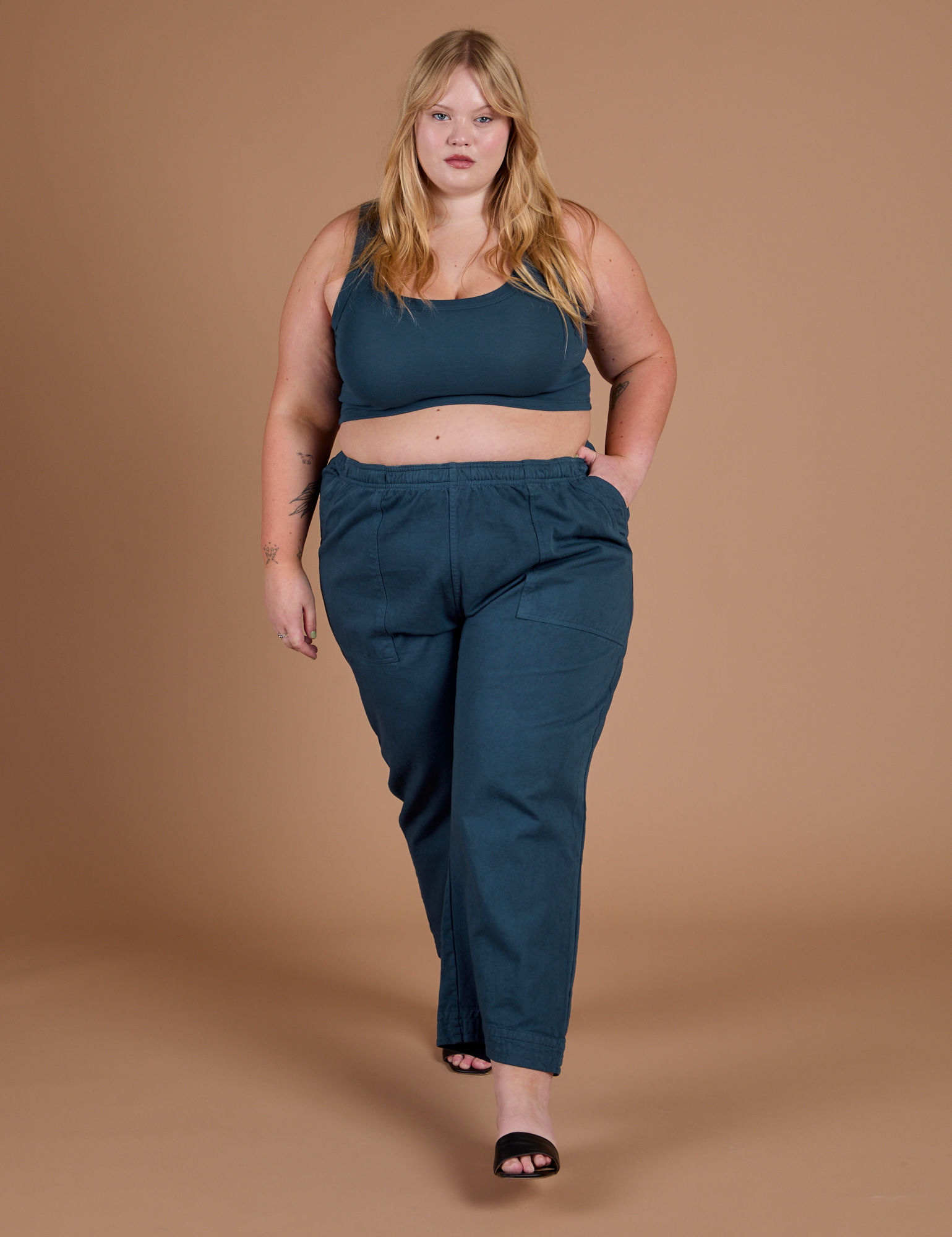 Juliet is Action Pants in Lagoon and Mini Tank in Lagoon