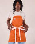 Full Denim Apron in Construction Orange worn by Jerrod