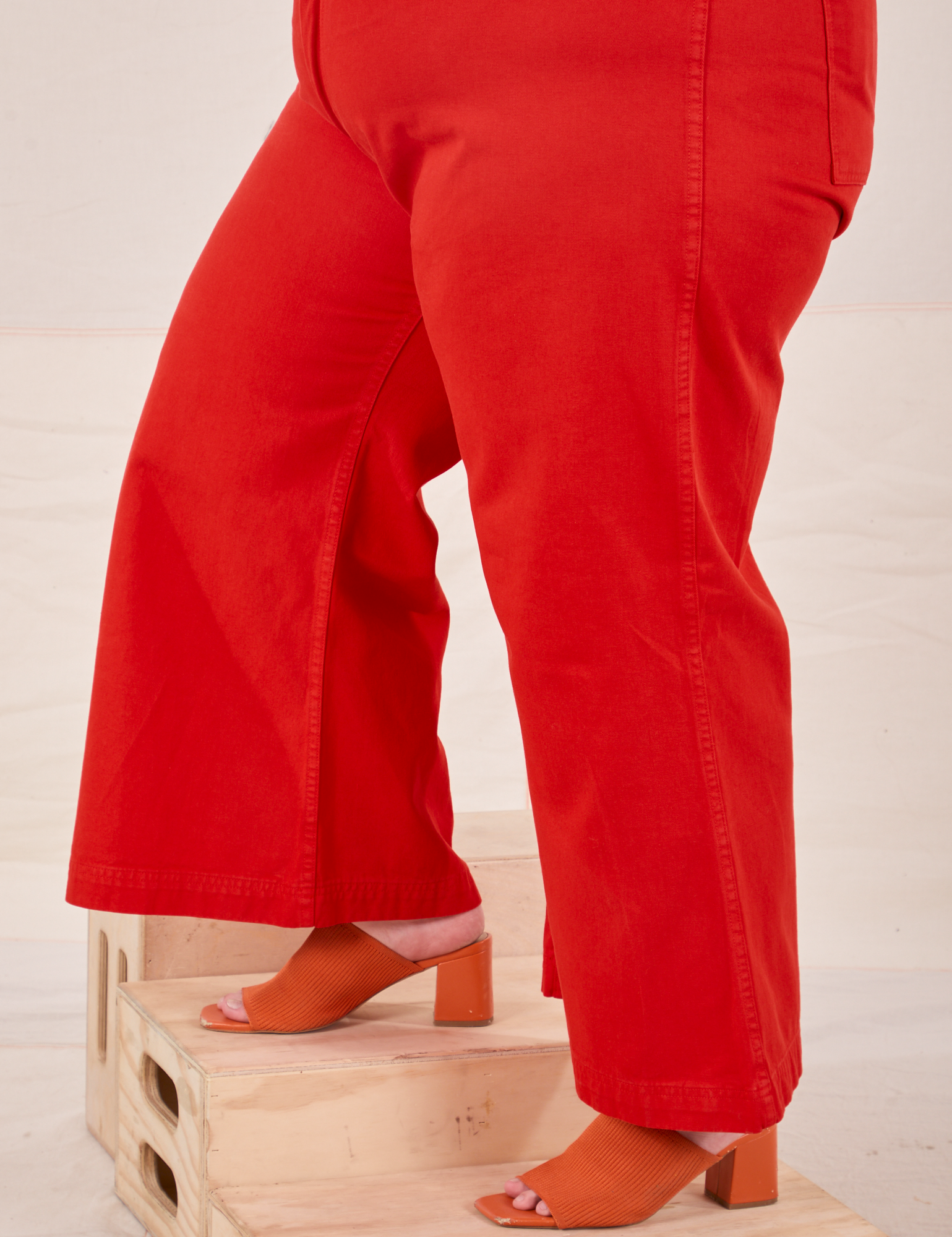 Bell Bottoms in Mustang Red pant leg side view close up on Marielena