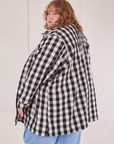 Angled back view of Big Gingham Field Coat on Catie