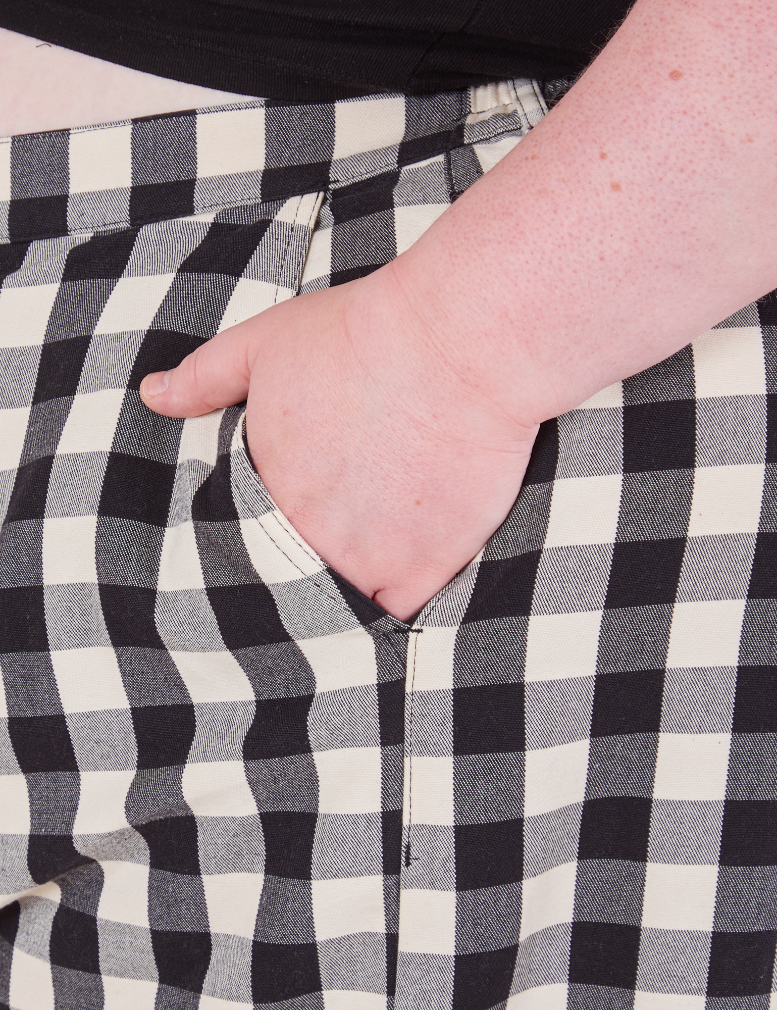Wide Leg Trousers in Big Gingham side close up. Catie has her hand in the pocket.