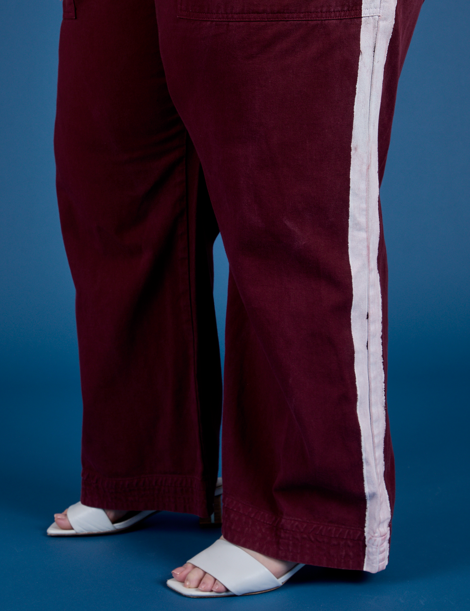 Painted Action Pants in Red Wine pant leg close up on Ashley
