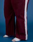 Painted Action Pants in Red Wine pant leg close up on Ashley