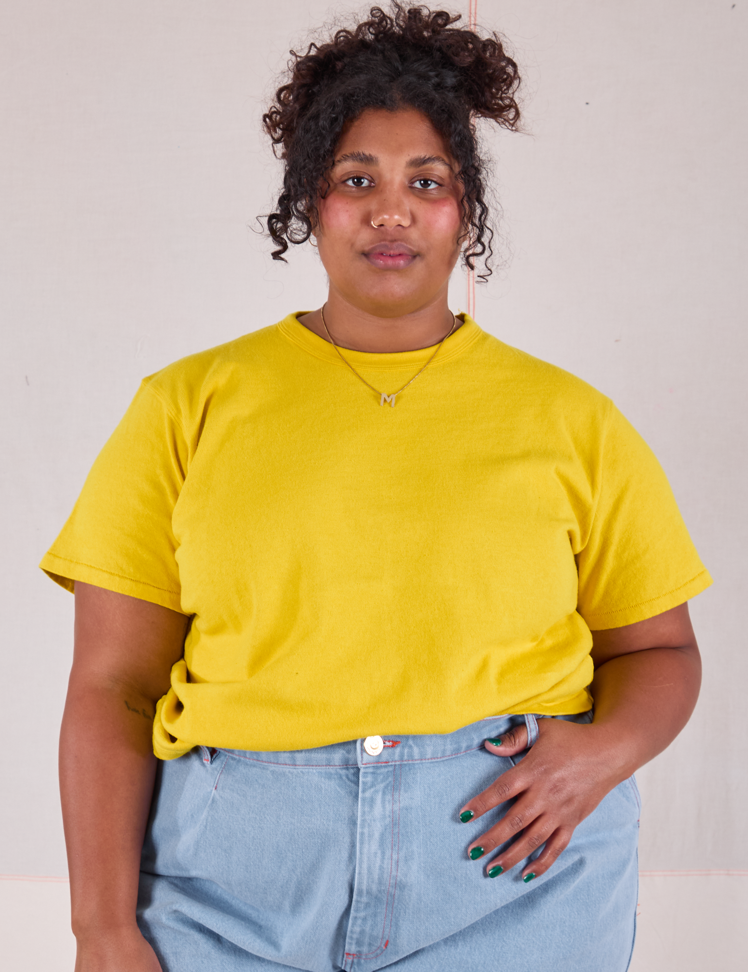 Morgan is 5&#39;5&quot; and wearing XL Burly Tee in Golden Yellow