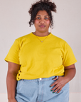 Morgan is 5'5" and wearing XL Burly Tee in Golden Yellow