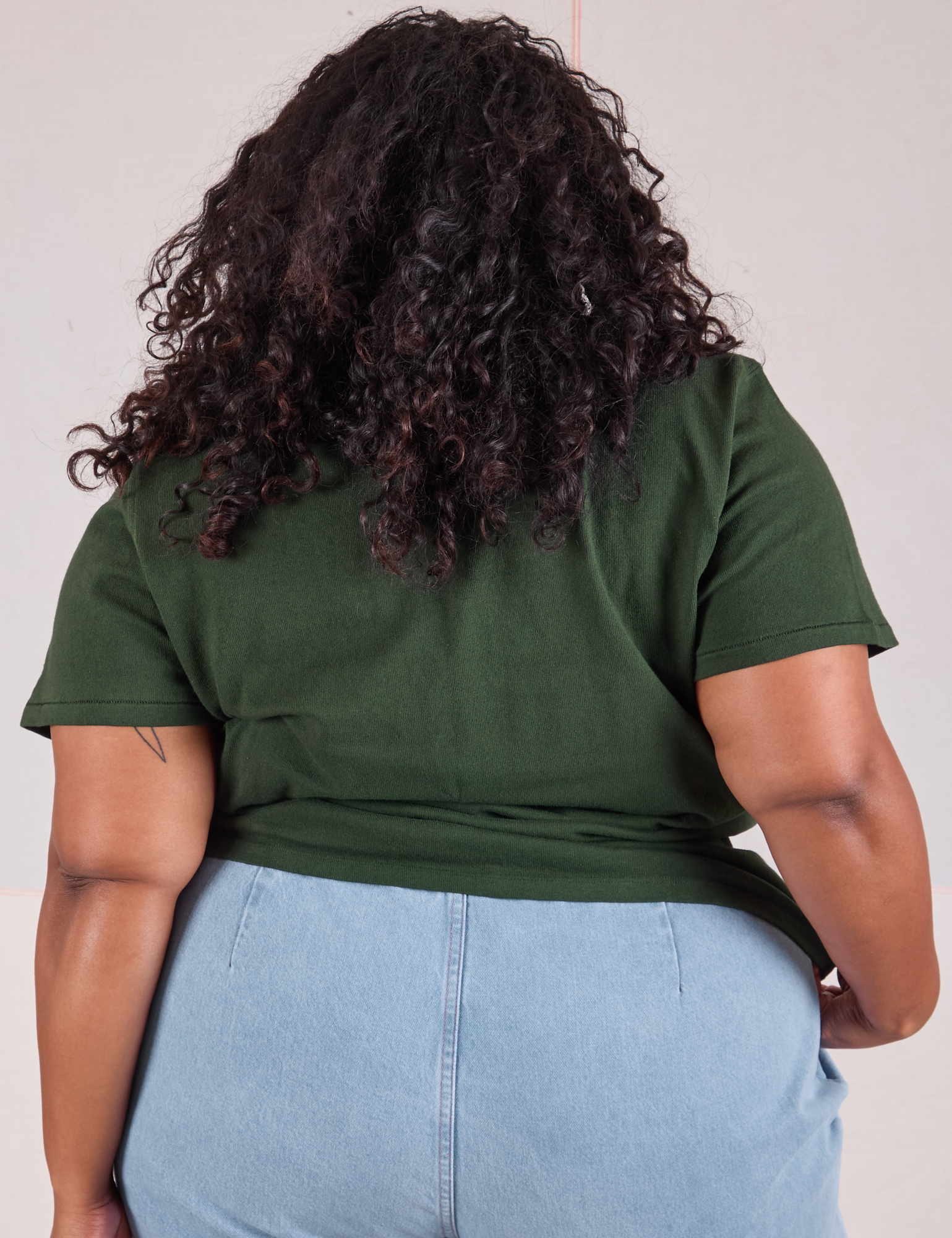 Burly Tee in Swamp Green back view on Morgan