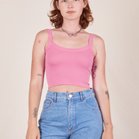 Alex is 5'8" and wearing P Cropped Cami in Bubblegum Pink paired with light wash Frontier Jeans