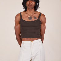 Jerrod is 6'3" and wearing S Cropped Cami in Espresso Brown paired with vintage off-white Western Pants