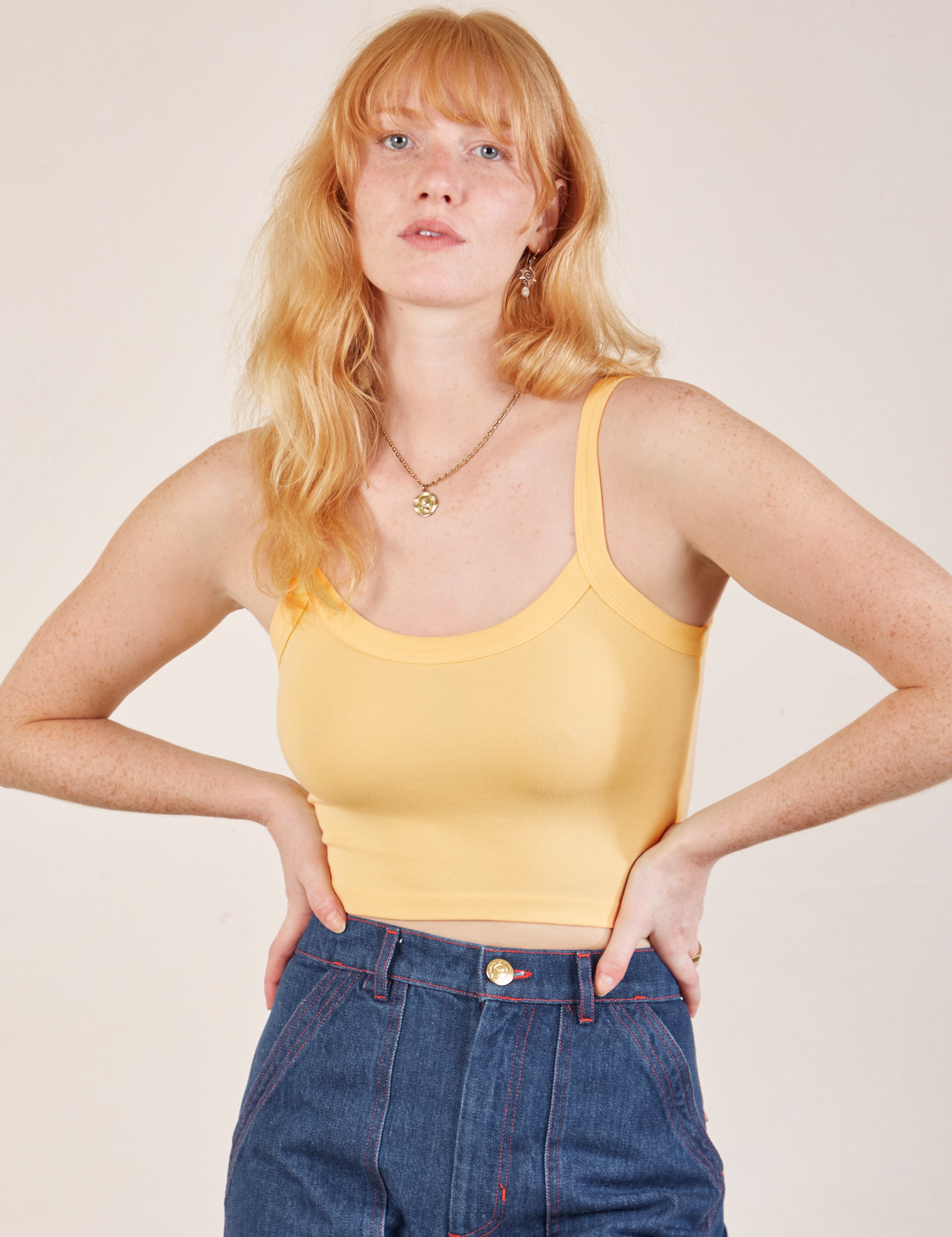 Margaret is 5’11” and wearing P Cropped Cami in Butter Yellow