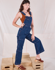 Carpenter Overalls in Dark Wash side view on Alex