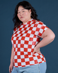 Angled front view of Checker Organic Tee in Red on Ashley