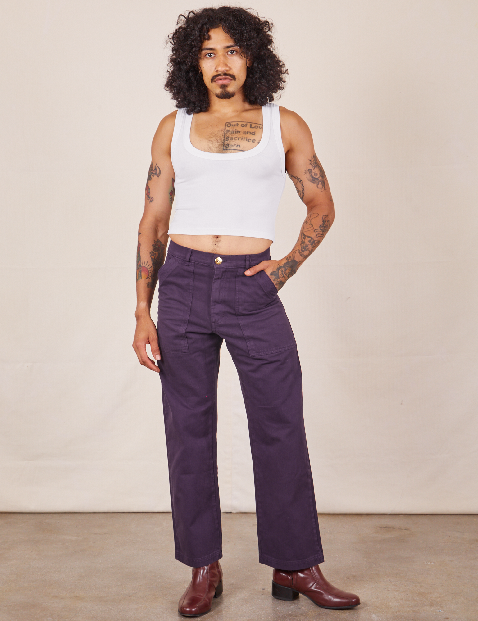 Jesse is 5&#39;8&quot; and wearing XS Work Pants in Nebula Purple