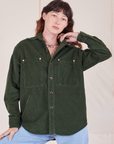 Alex is 5'8" and wearing P Corduroy Overshirt in Swamp Green