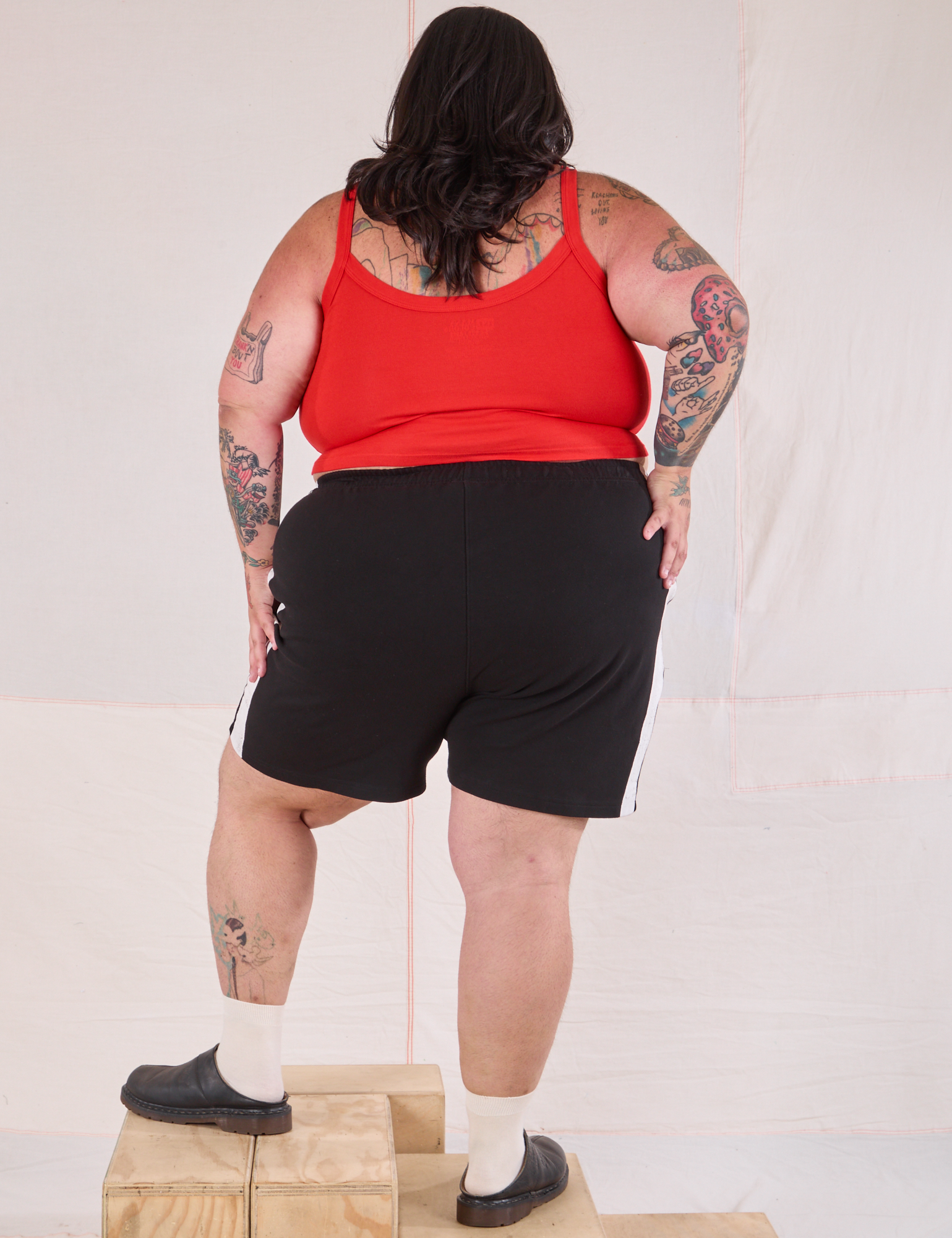 Back view of Painted Stripe Easy Shorts in Basic Black and mustang red Cropped Cami oNnSam
