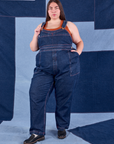 Marielena is 5'8" and wearing 2XL Indigo Denim Original Overalls in Dark Wash