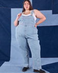 Marielena is 5'8" and wearing 2XL Indigo Denim Original Overalls in Light Wash