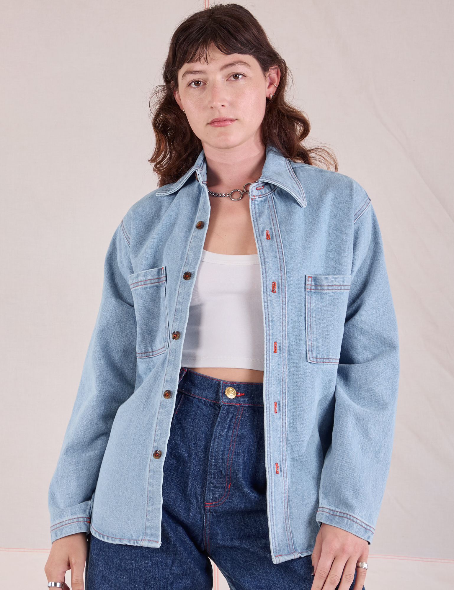 Alex is wearing Denim Overshirt in Light Wash with a Cropped Cami in Vintage Tee Off-White underneath