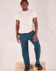 Issac is 5'10" and wearing M Easy Pants in Lagoon paired with Organic Vintage Tee in vintage tee off-white