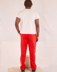 Back view of Easy Pants in Mustang Red and Organic Vintage Tee in Vintage Tee Off-White on Issac