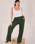 Tiara is 5'4" and wearing S Easy Western Pants in Swamp Green