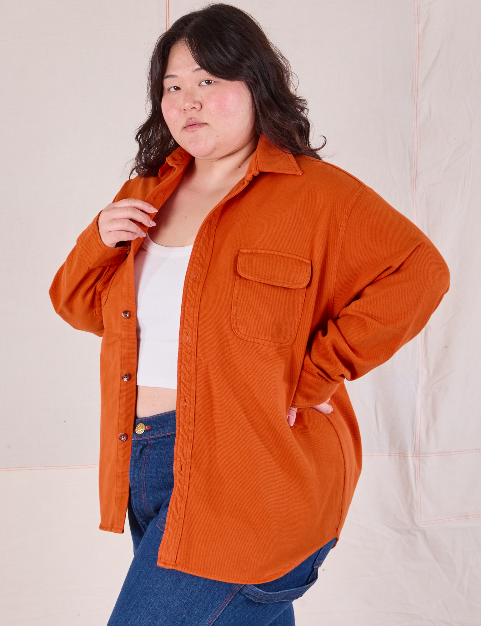 Angled front view of Flannel Overshirt in Burnt Orange on Ashley