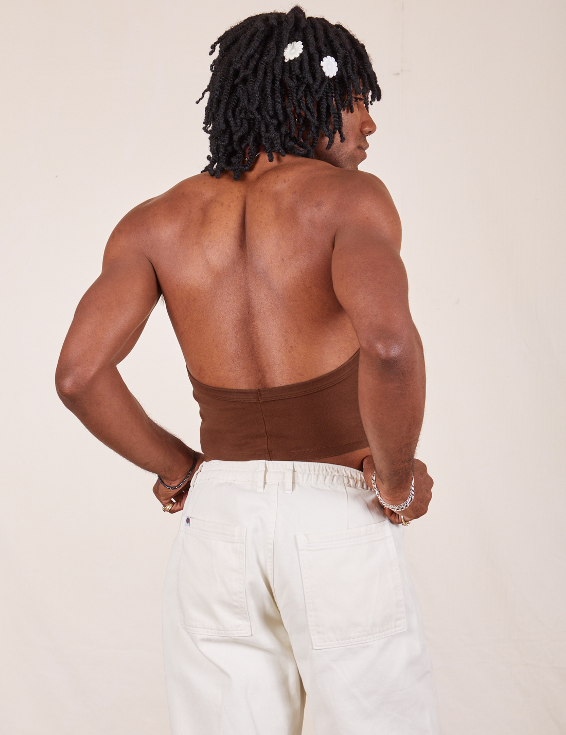 Back view of Halter Top in Fudgesicle Brown and vintage off-white Western Pants worn by Jerrod