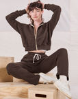 Alex is wearing Cropped Zip Hoodie in Espresso Brown and matching Rolled Cuff Sweat Pants
