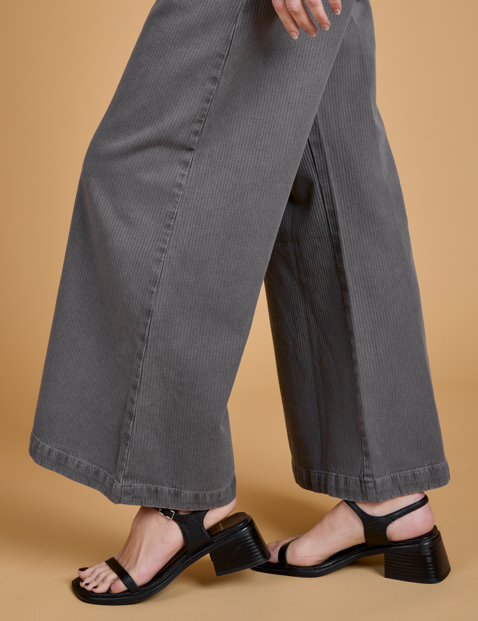 Side pant leg close up of Heritage Wide Leg Trousers in Washed Grey on Alex