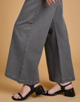 Side pant leg close up of Heritage Wide Leg Trousers in Washed Grey on Alex