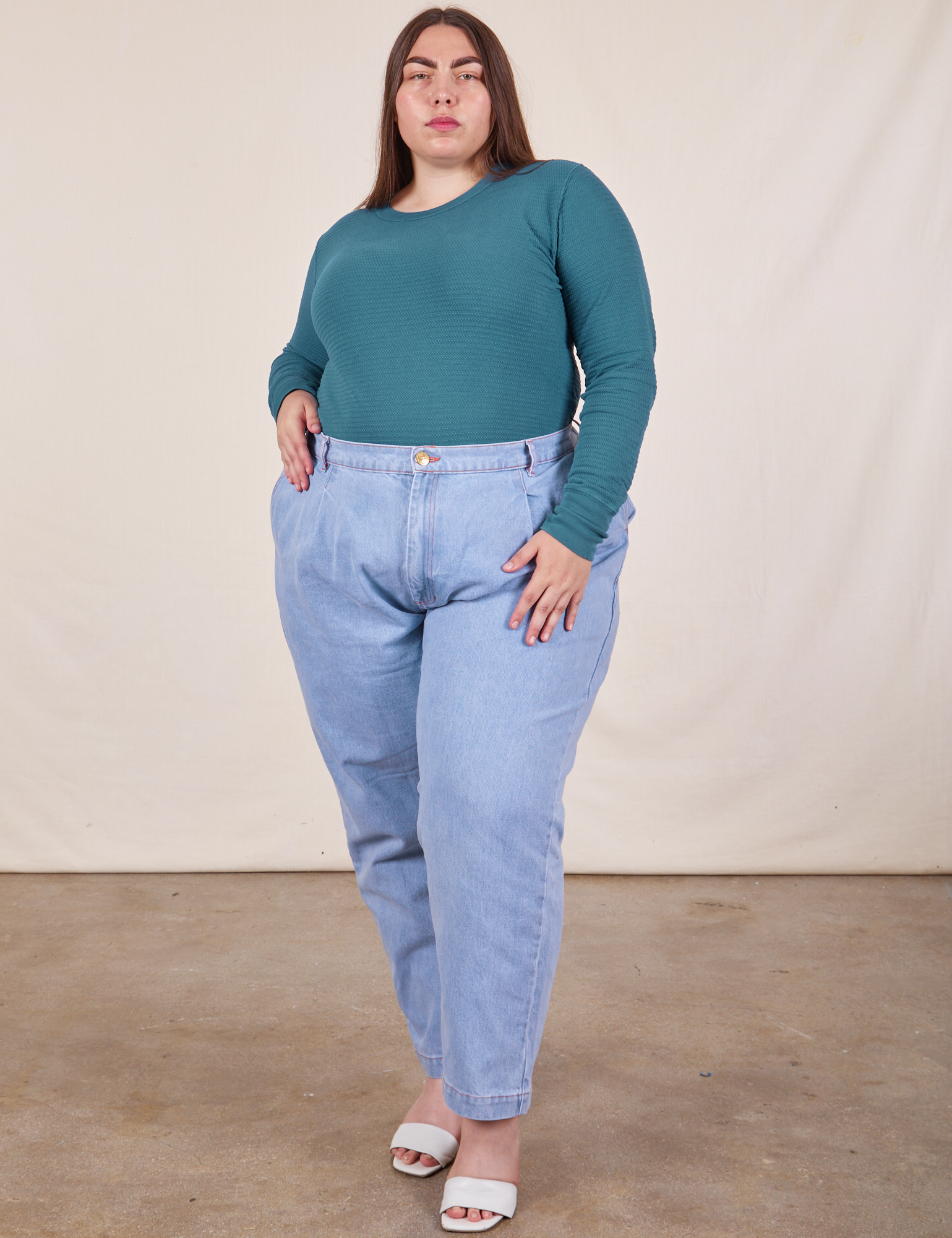 Marielena is wearing Honeycomb Thermal in Marine Blue tucked into light wash Denim Trousers