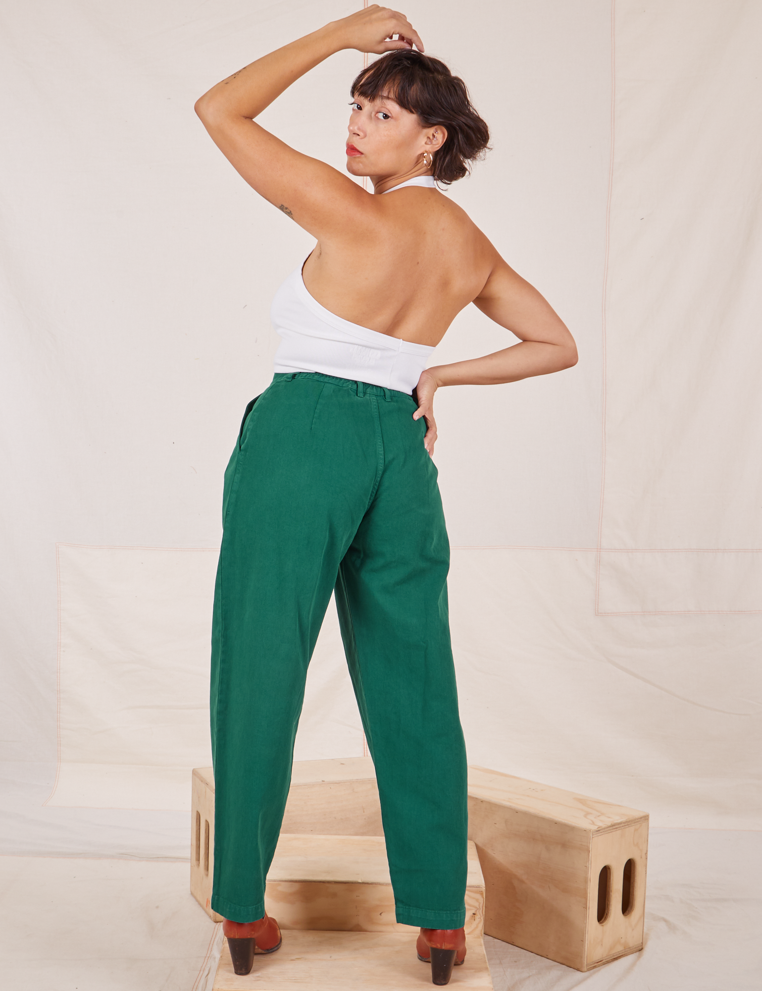 Back view of Heavyweight Trousers in Hunter Green and vintage off-white Halter Top